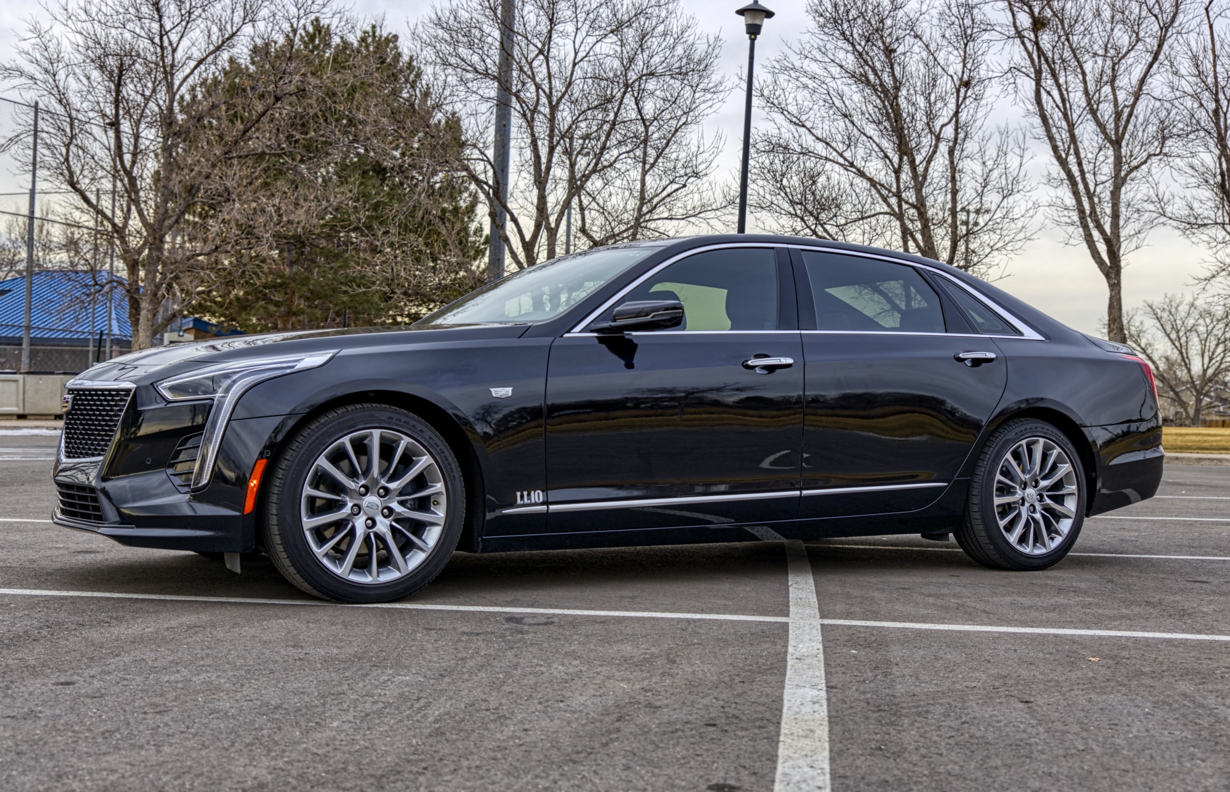 A black Cadillac CT6 with a reflective shine and beautiful wheels.